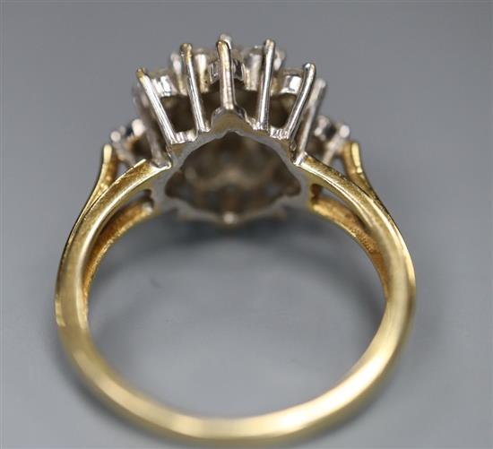 A modern 18ct gold and diamond cluster ring, size J, gross 4.2 grams.